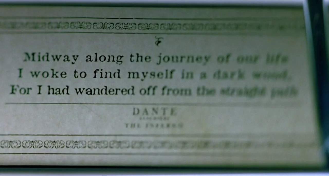 In The Cut (2003) movie still: closeup — An off-white paper page from a book contains black printed text. The passage displays the opening lines of…
