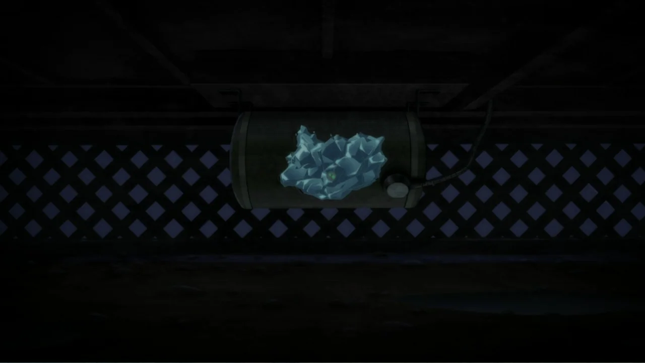 Suicide Squad: Hell to Pay (2018) movie still: establishing — A dark, enclosed space features a metal tank mounted on a lattice-patterned wall. A…