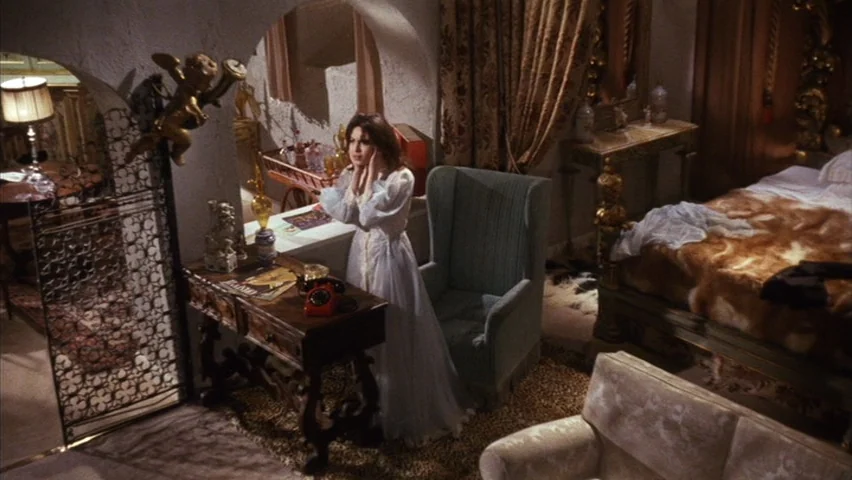 Black Sabbath (1963) movie still: fullbody — A lavish hotel suite features heavy drapes, a four-poster bed, and ornate antique furniture. A woman in…