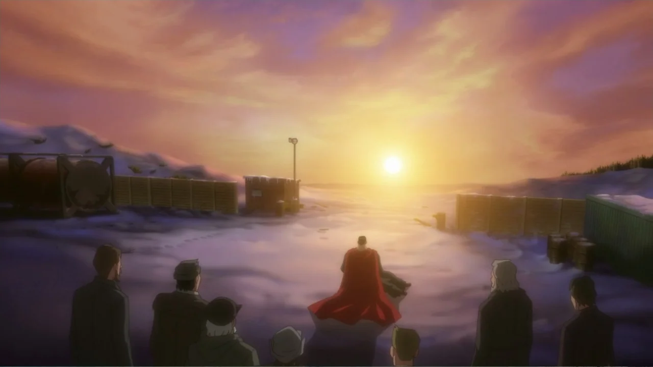 Superman: Red Son (2020) movie still: wide — A snowy industrial clearing under a sunset sky with a perimeter fence visible. A group of men stands in…