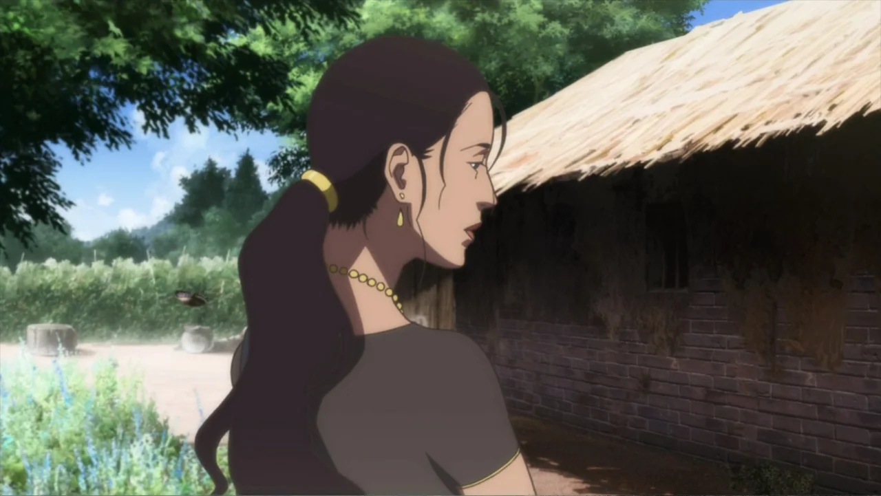 Batman: Gotham Knight (2008) movie still: medium — A rural setting features a small rustic house with a thatched roof and brick walls. A young woman…