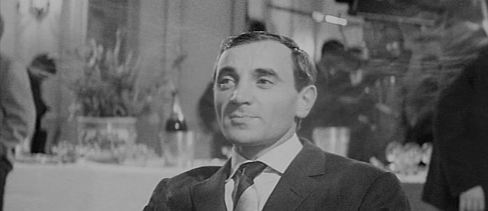 Shoot The Piano Player (Tirez Sur Le Pianiste) (1960) movie still: closeup — An interior space appears to be a crowded reception or banquet with…