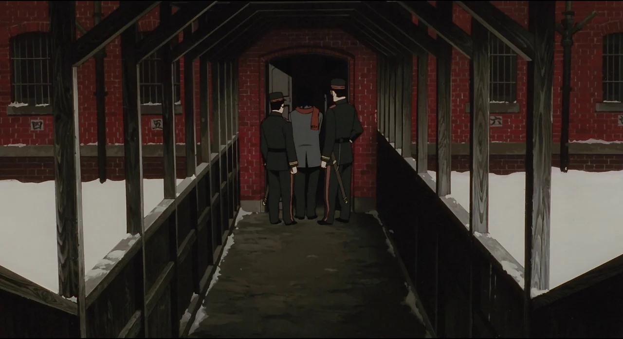 Millenium Actress (2001) movie still: fullbody — A covered walkway connects red brick buildings dusted with winter snow. Two uniformed guards escort…