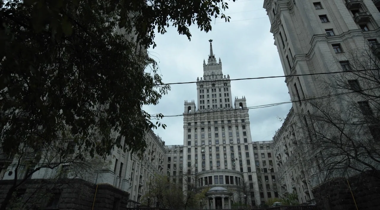 The Death of Stalin (2017) movie still: establishing — A massive, ornate Stalinist-era skyscraper towers over the viewer against an overcast sky.…