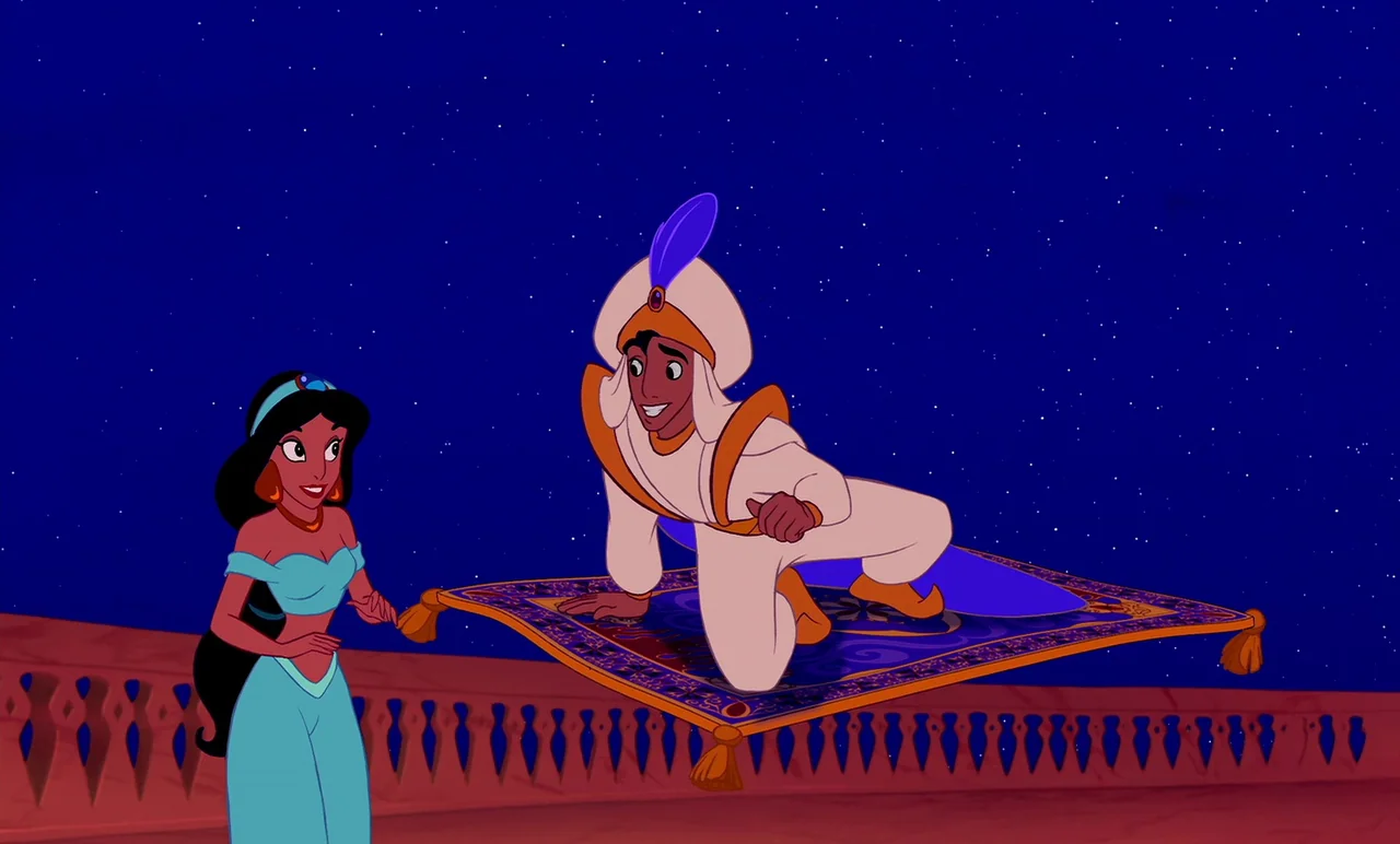 Aladdin (1992) movie still: fullbody — A terracotta balcony with a carved stone railing sits beneath a vast starlit night sky. A man on a patterned…