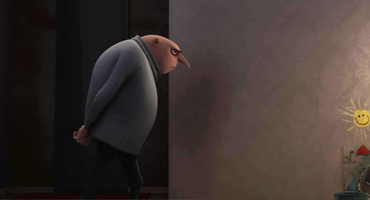 Despicable Me (2010) movie still: medium — An interior hallway with a textured beige wall featuring a child's crayon drawing. A bald man in a grey…