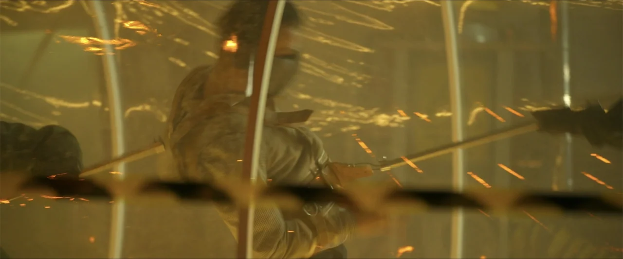 Apocalypse Z: The Beginning of the End (2024) movie still: medium — A translucent plastic barrier separates the subject from the source of flying…