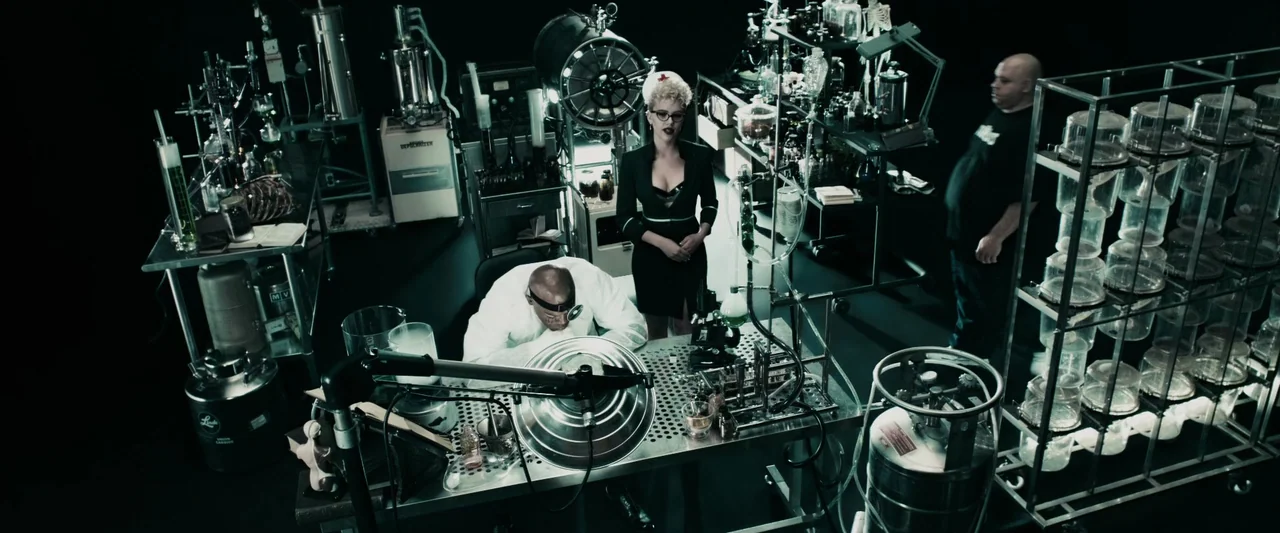 The Spirit (2008) movie still: wide — A dark laboratory filled with glass equipment, metal shelving units, and various scientific apparatus. A…