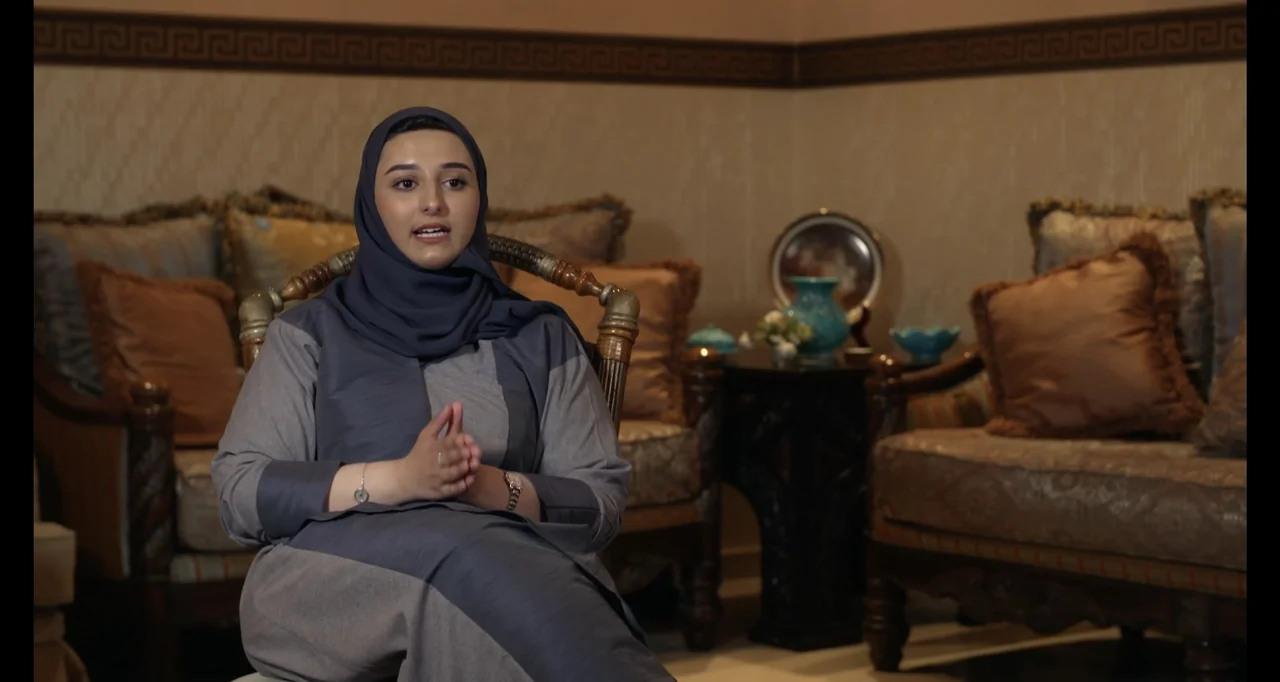 Saudi Women's Driving School (2019) movie still: medium — An opulent interior space with carved wooden furniture, patterned cushions, and geometric…