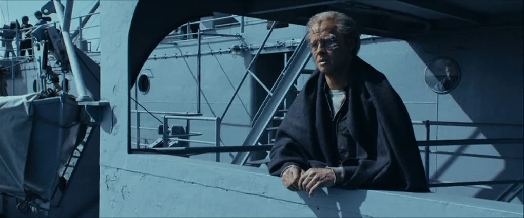 The Curious Case Of Benjamin Button (2008) movie still: medium — The exterior deck of a grey military vessel displays metallic structures and…