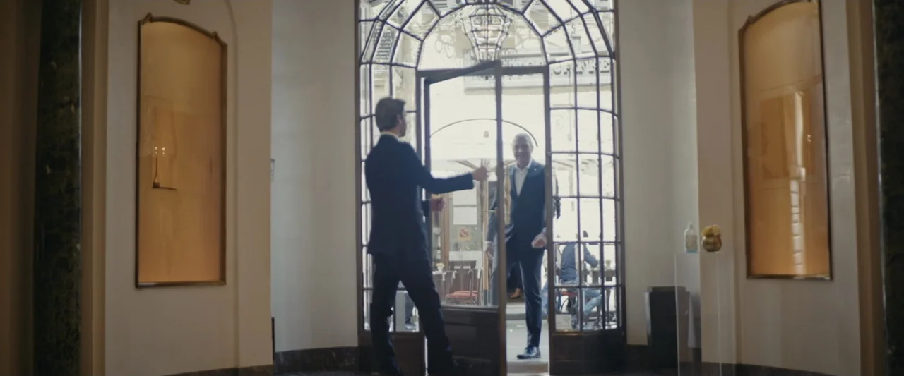 An emperor's jewel - The making of the Bulgari Hotel Roma (2024) movie still: fullbody — An elegant hotel lobby entrance features a large arched…