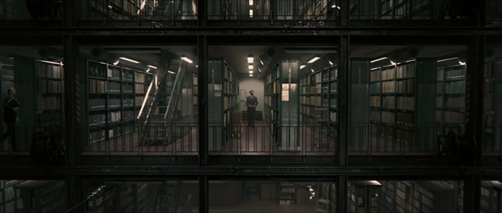 Tinker Tailor Soldier Spy (2011) movie still: wide — A multi-level industrial metal archive facility features long aisles of document-filled…