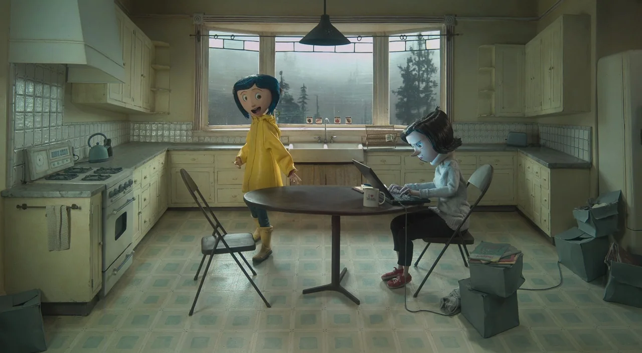 Coraline (2009) movie still: wide — A dated, pale yellow kitchen features a bay window overlooking a misty, dark forest. One character stands in a…