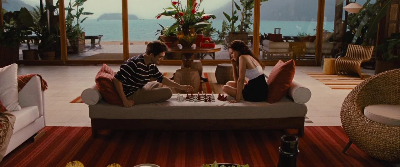 The Twilight Saga: Breaking Dawn – Part 1 (2011) movie still: wide — A luxury open-plan room features floor-to-ceiling windows overlooking a…
