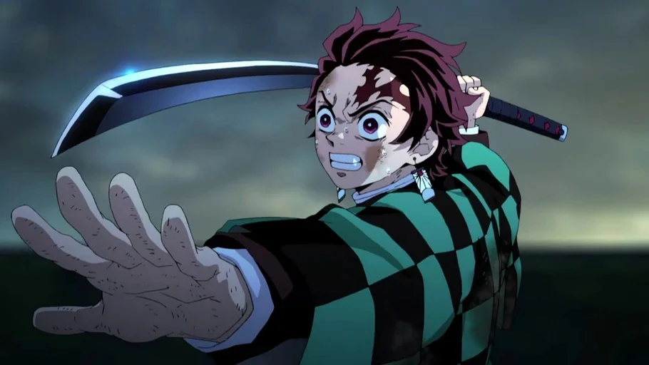 Demon Slayer: Kimetsu no Yaiba (2019) movie still: medium — An open field at night under an overcast sky serves as a backdrop. A young male fighter…