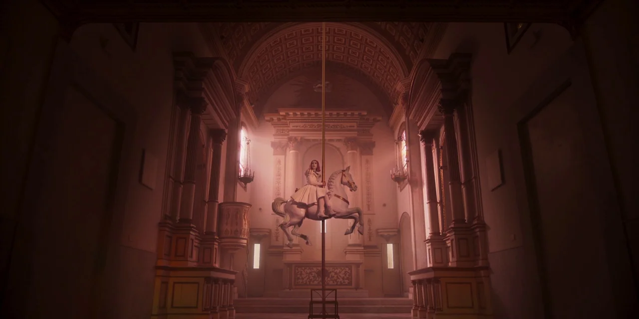 Paradise Hills (2019) movie still: wide — A church nave features classical architectural details including columns and arched ceiling vaults. A…