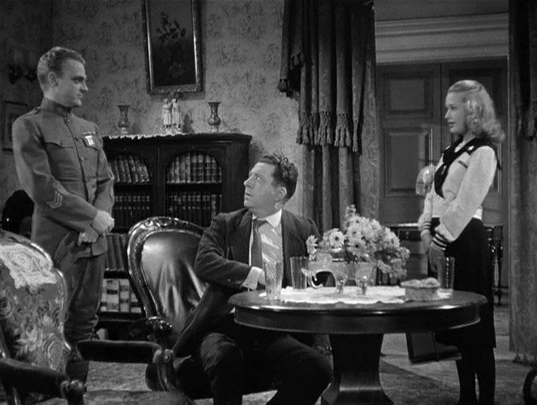 The Roaring Twenties (1939) movie still: medium — A furnished home interior with patterned wallpaper and a central circular wooden table. A soldier…