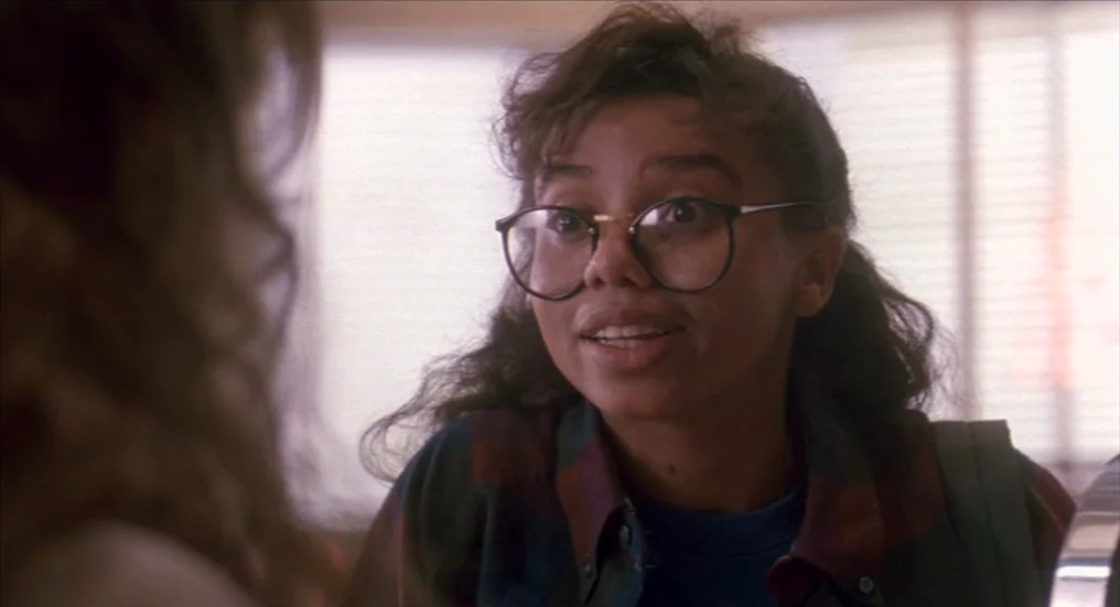 A Nightmare On Elm Street 4: The Dream Master (1988) movie still: closeup — A bright indoor space with blurred window blinds in the background. A…