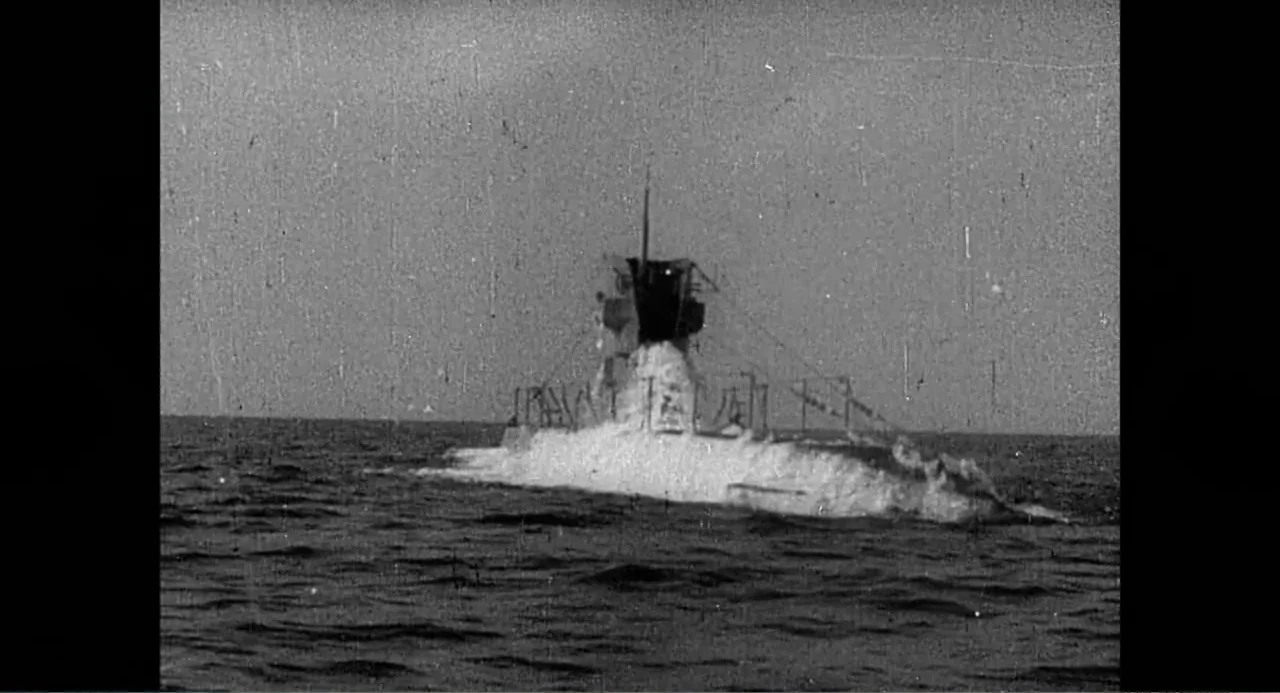 Made in England: The Films of Powell and Pressburger (2024) movie still: wide — A military submarine breaks the surface of the choppy dark ocean…