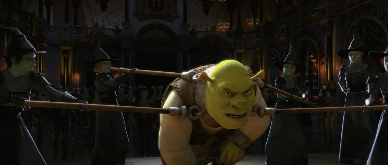 Shrek Forever After (2010) movie still: medium — A dark grand hall with stone architecture and multiple figures in the background. Green ogre Shrek…