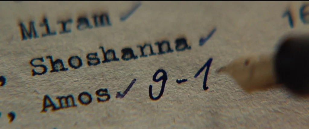 Inglourious Basterds (2009) movie still: closeup — A textured off-white piece of paper features typed names and handwritten numerical entries. A…