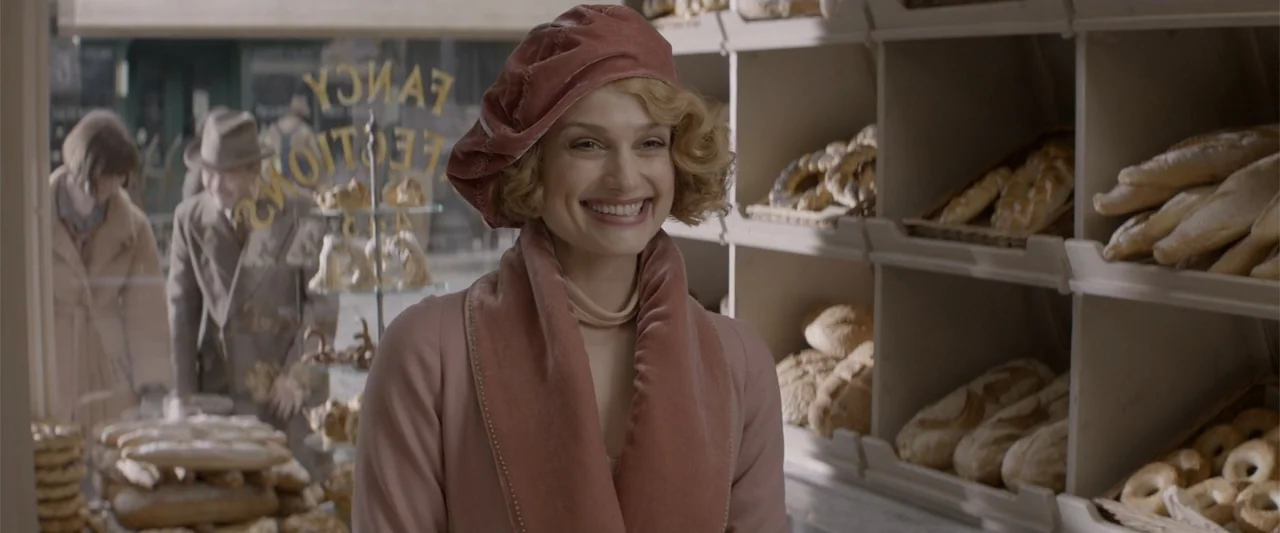 Fantastic Beasts and Where to Find Them (2016) movie still: medium — A 1920s-style bakery interior features wooden shelves stocked with various…