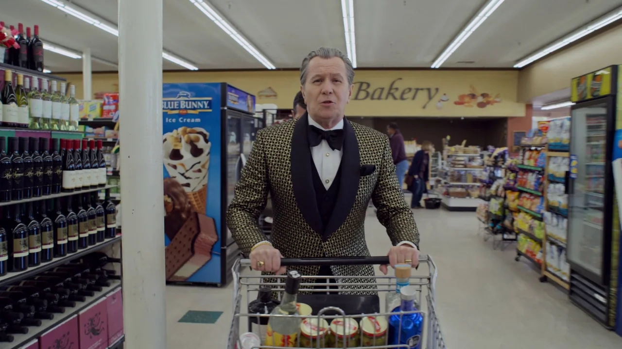 The Laundromat (2019) movie still: medium — A well-lit grocery store interior features aisles stocked with wine bottles and refrigerated displays.…