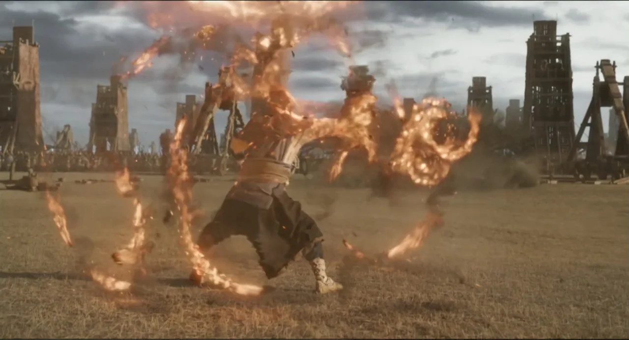 Legends of the Condor Heroes: The Gallants (2025) movie still: fullbody — A vast, dusty field features wooden siege towers under a gray, overcast…