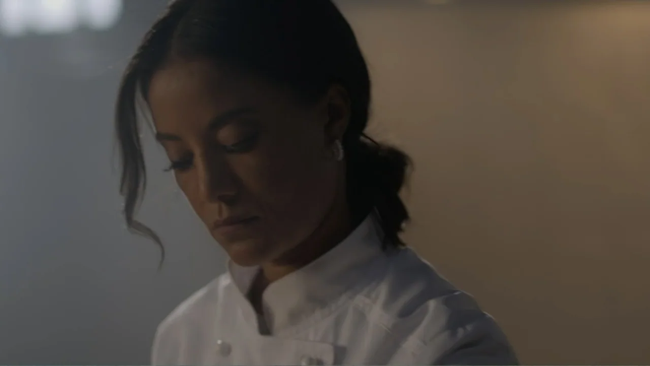 A Pinch of Portugal (2023) movie still: medium — A professional kitchen interior featuring blurred background surfaces and soft ambient…
