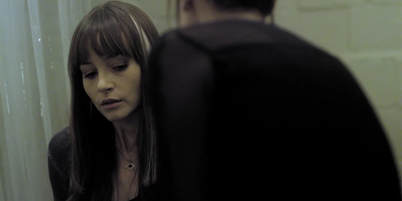 Stalked by My Doctor: A Sleepwalker's Nightmare (2019) movie still: medium — An interior bathroom space with pale textured walls and white fabric…