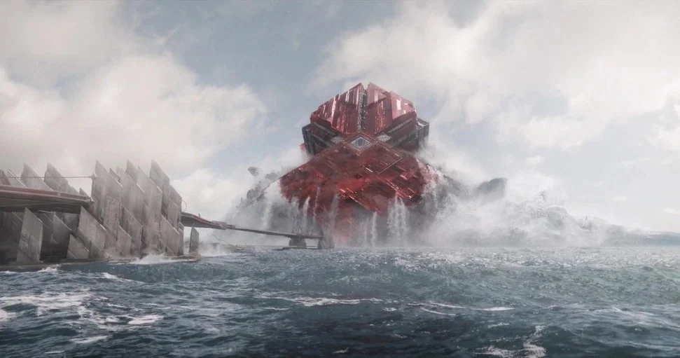 Guardians of the Galaxy Vol. 3 (2023) movie still: establishing — A colossal crystalline red structure rests within a rough sea under a cloudy sky.…