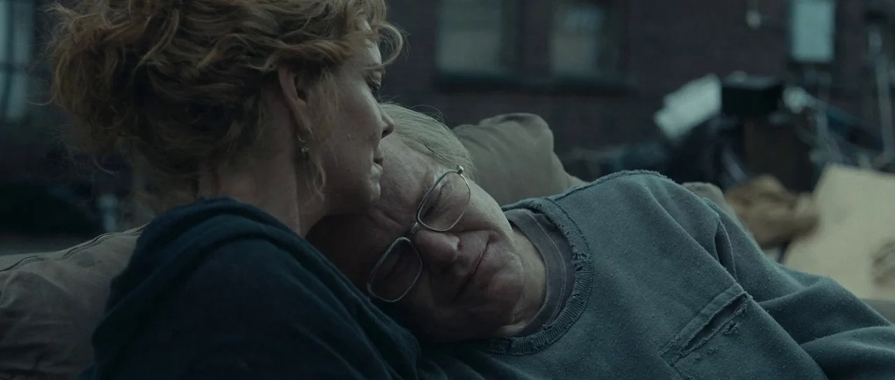 Synecdoche, New York (2008) movie still: closeup — An urban rooftop setting featuring dark brick architecture and scattered debris in the…