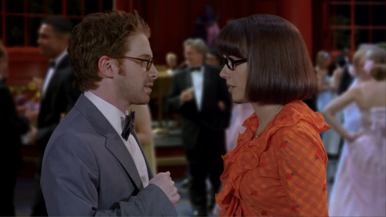 Scooby-Doo 2: Monsters Unleashed (2004) movie still: medium — A festive indoor event space features people in formal wear and red decorative…