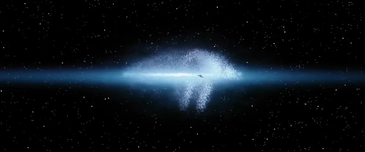 Independence Day (1996) movie still: wide — A spiral galaxy filled with bright blue light sits amidst the vast blackness of space. Thousands of tiny…