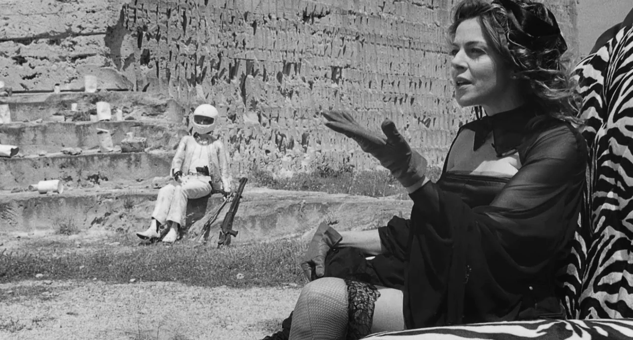 The Legend Of Kaspar Hauser (2012) movie still: medium — A stone quarry features tiered benches against a rough rock cliff background. A woman in a…