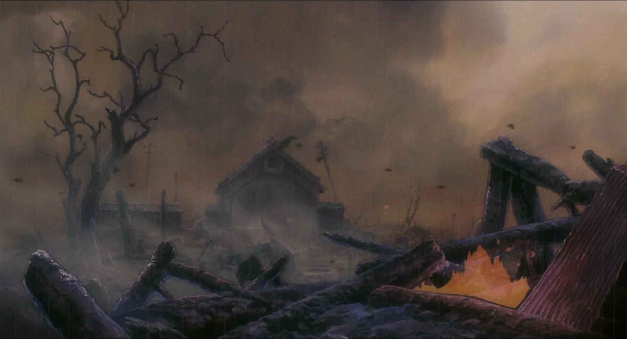 Grave of the Fireflies (1988) movie still: establishing — A decimated landscape of charred wooden debris and ruins under a dark, smoky sky. Rain…