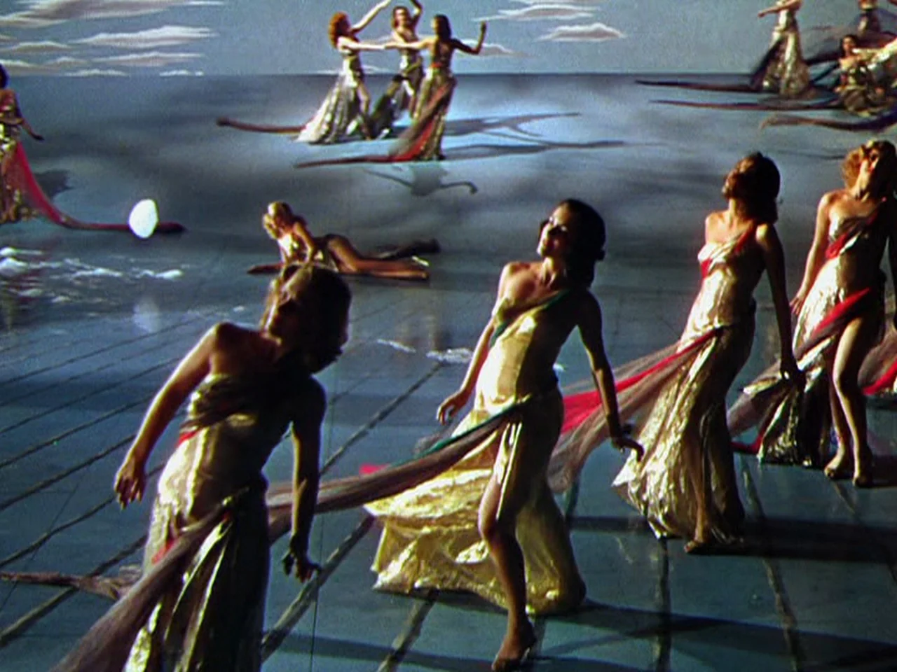Ziegfeld Follies (1945) movie still: wide — A theatrical stage features a painted floor resembling rippling water and stylized clouds. Multiple…