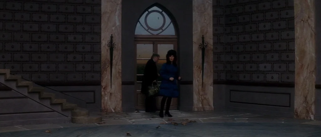 You Ain’t Seen Nothin’ Yet (2012) movie still: wide — A spacious entryway features marble pillars and patterned walls with a gothic arched window. A…
