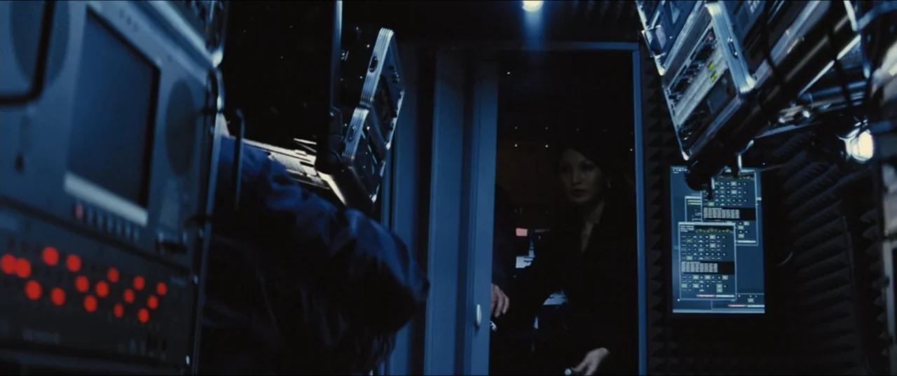 Jack Ryan: Shadow Recruit (2014) movie still: medium — A dark, cramped mobile surveillance unit filled with rack-mounted servers and digital…