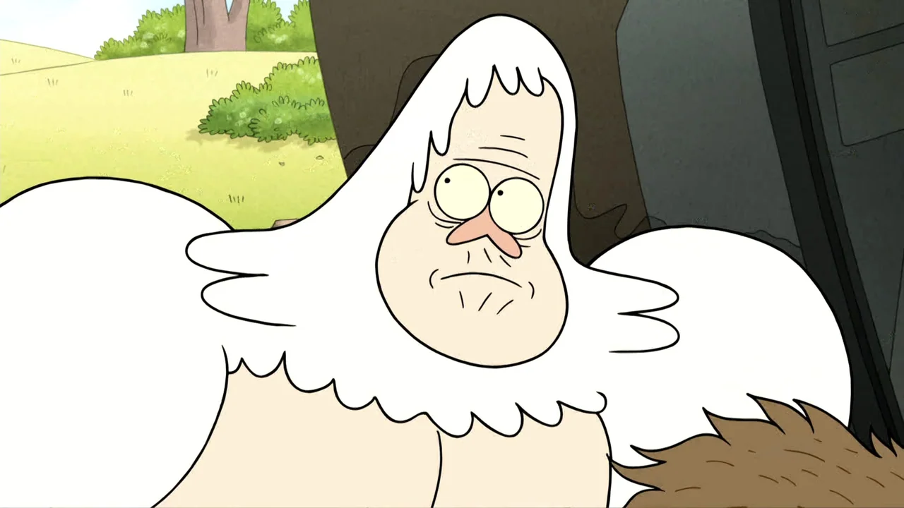 Regular Show: The Movie (2015) movie still: medium — A grassy field with a distant tree and dark structural element in the background. A large white…