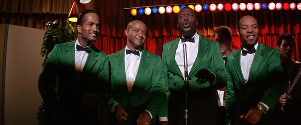 Viva Las Vegas (1964) movie still: medium — A dimly lit musical performance space featuring red curtains and colorful overhead lighting fixtures.…