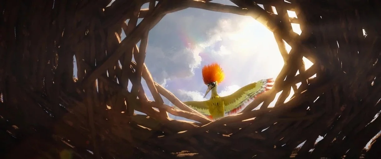The Wild Robot (2024) movie still: wide — A view from inside a large, circular nest constructed of interwoven branches and sticks. A small, colorful…