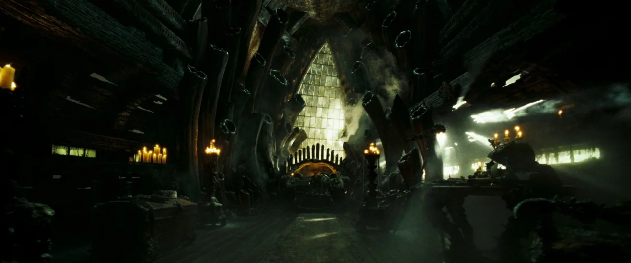 Pirates of the Caribbean: Dead Man’s Chest movie still: wide — An expansive, dark fantasy throne room features massive, organic-looking pillars…
