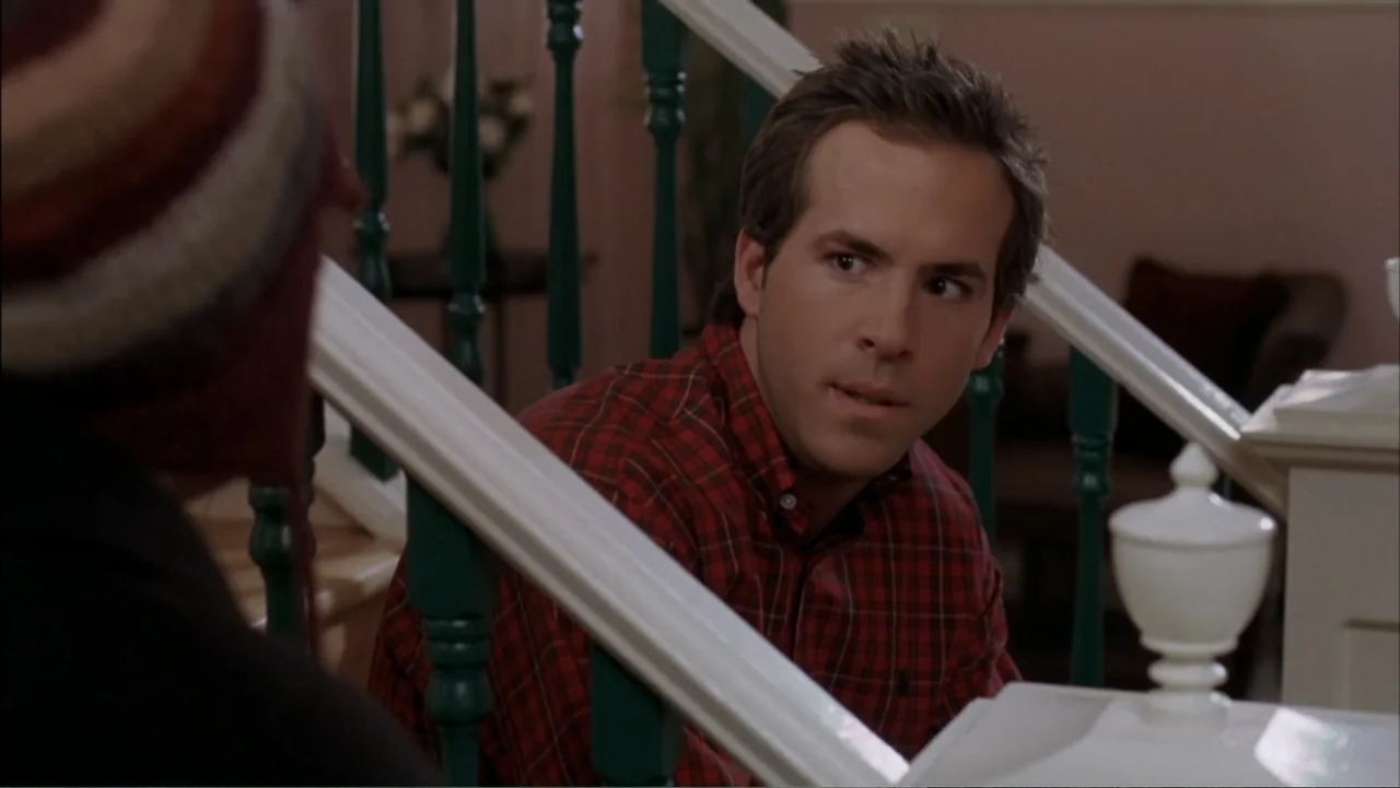 Just Friends (2005) movie still: medium — An interior staircase with white railings and dark green vertical balusters. A man in a red plaid shirt…