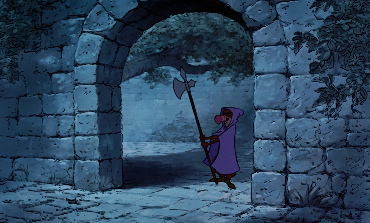 Robin Hood (1973) movie still: wide — A stone archway made of large, weathered blocks stands under a dark night sky. A small, caped figure holding a…