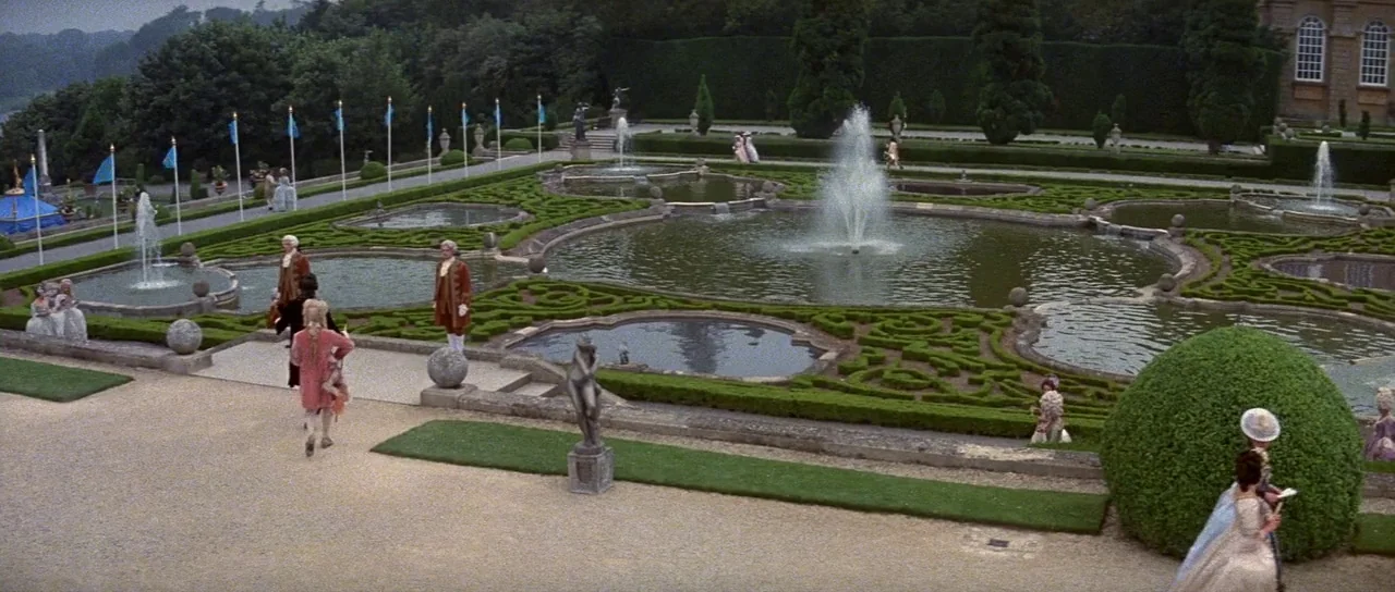 History of the World: Part 1 (1981) movie still: wide — A vast geometric landscape with interconnected ponds and fountains bordered by manicured…