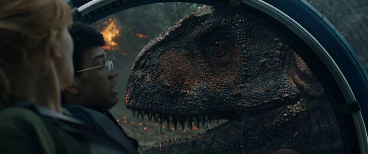 Jurassic World: Fallen Kingdom (2018) movie still: medium — Inside a transparent spherical pod, a man and woman observe a large predatory dinosaur.…