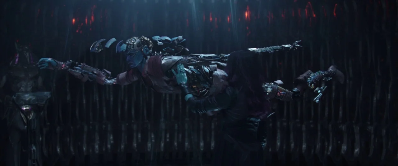 Avengers: Infinity War (2018) movie still: medium — A dimly lit technological bay features vertical wall textures and glowing red accent lights. One…
