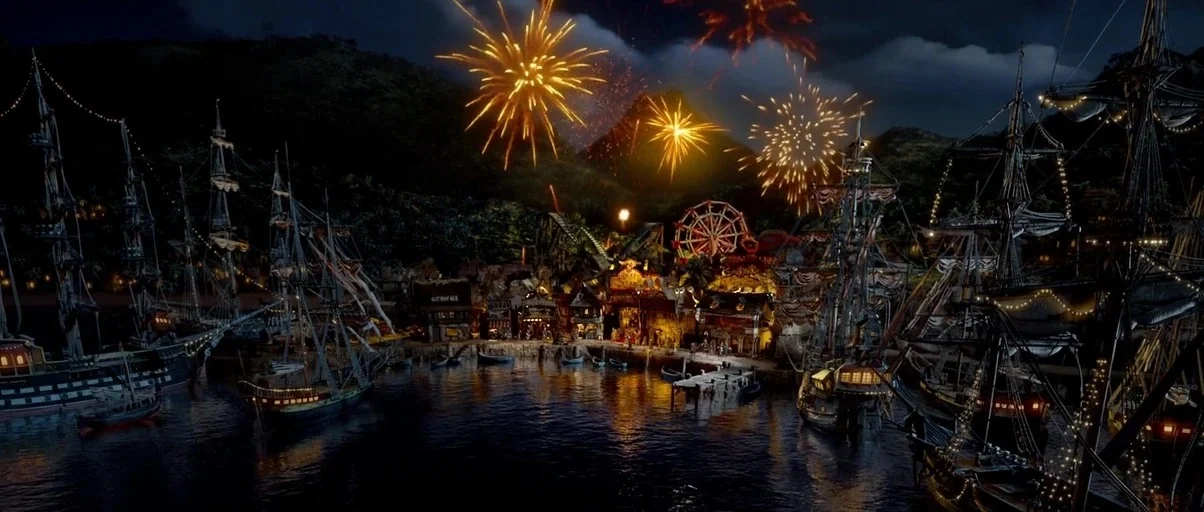 The Pirates! Band of Misfits (2012) movie still: establishing — A nighttime harbor features multiple docked tall wooden sailing ships under a dark…