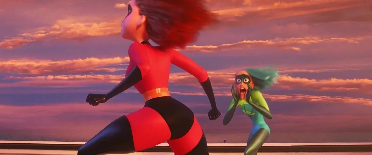Incredibles 2 (2018) movie still: fullbody — A rooftop terrace stretches across the frame against a backdrop of a colorful sunset. A woman in a red…